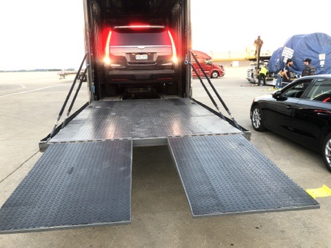 Vehicle loading into a cargo aircraft using a ramp