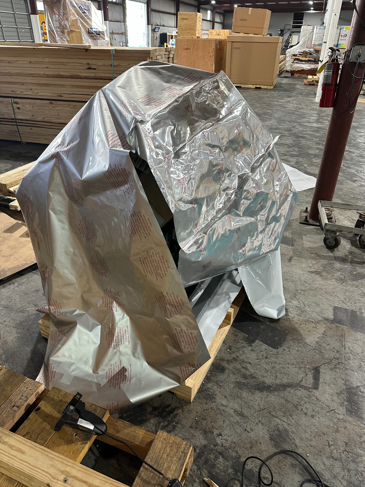 Equipment wrapped in silver moisture barrier film