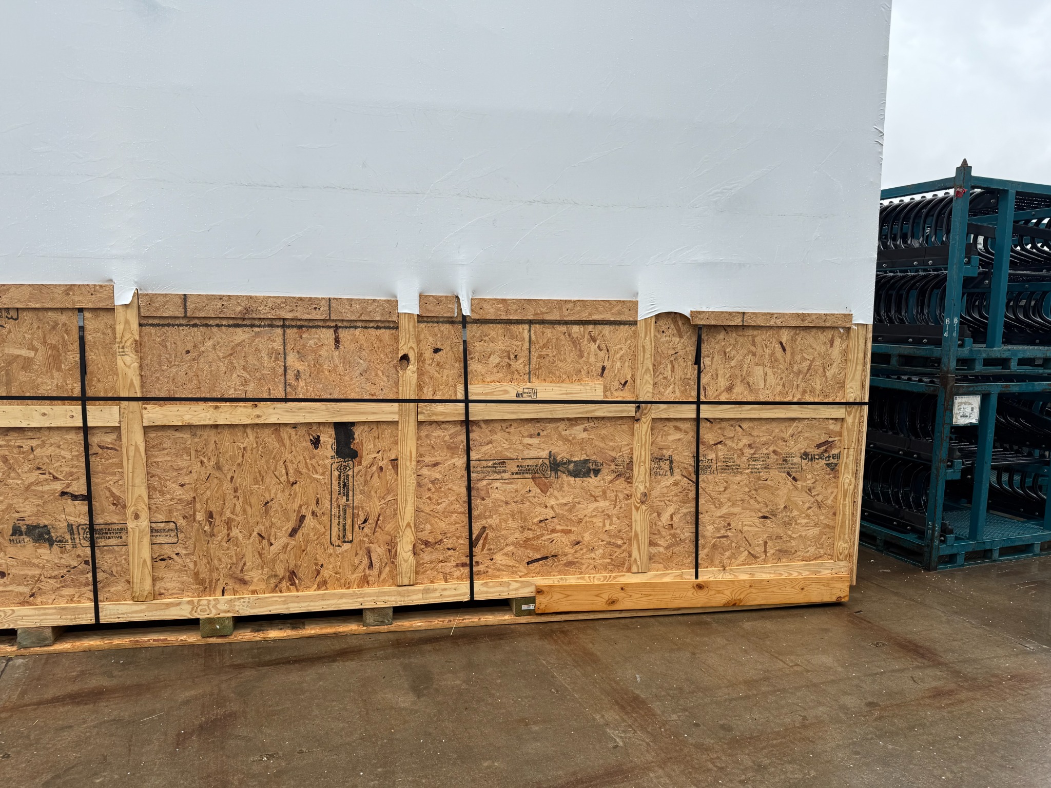 A row of custom wooden export crates on the Atlanta's Best Packaging dock