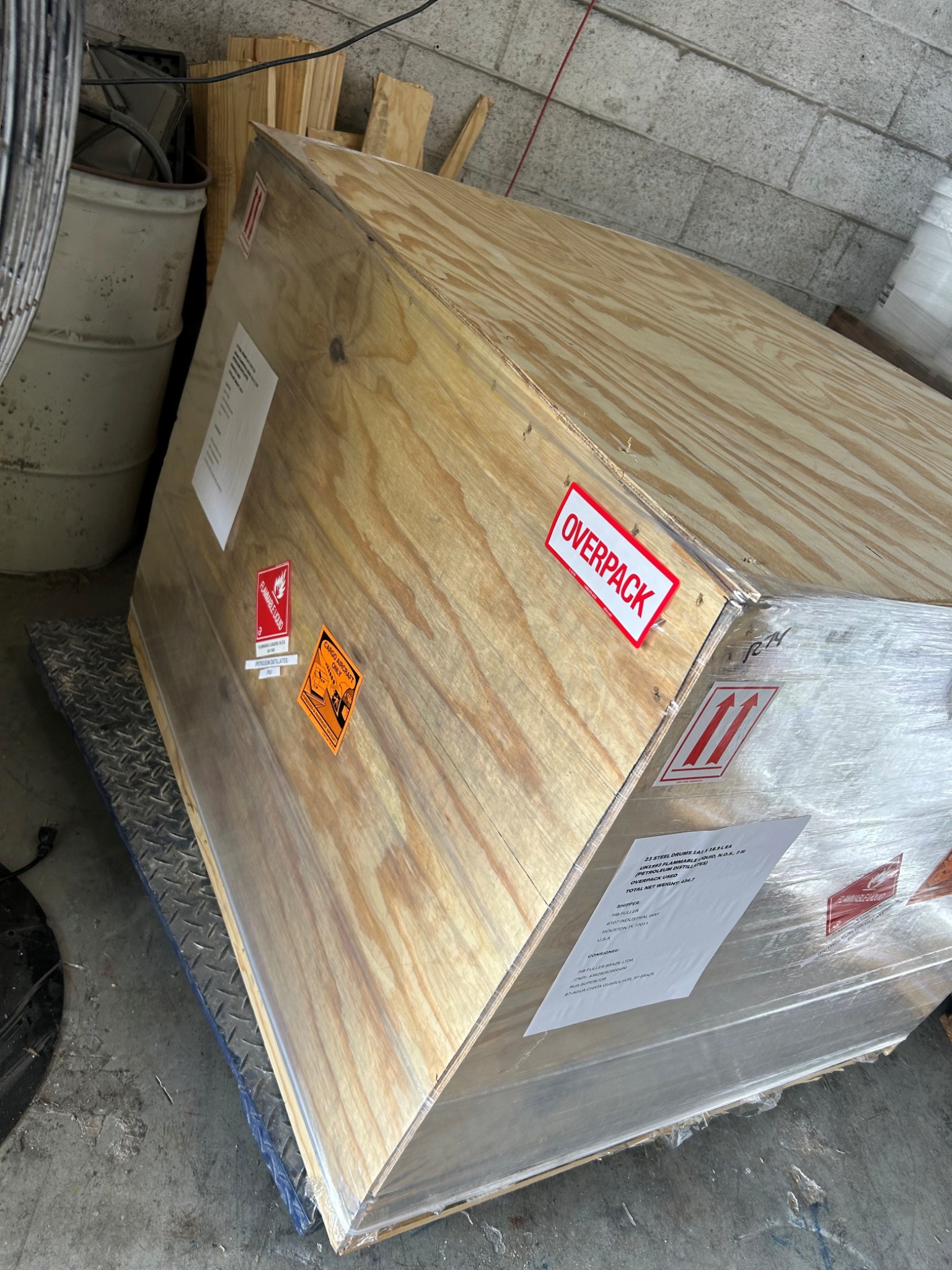 Side view of a dangerous goods crate with handling labels
