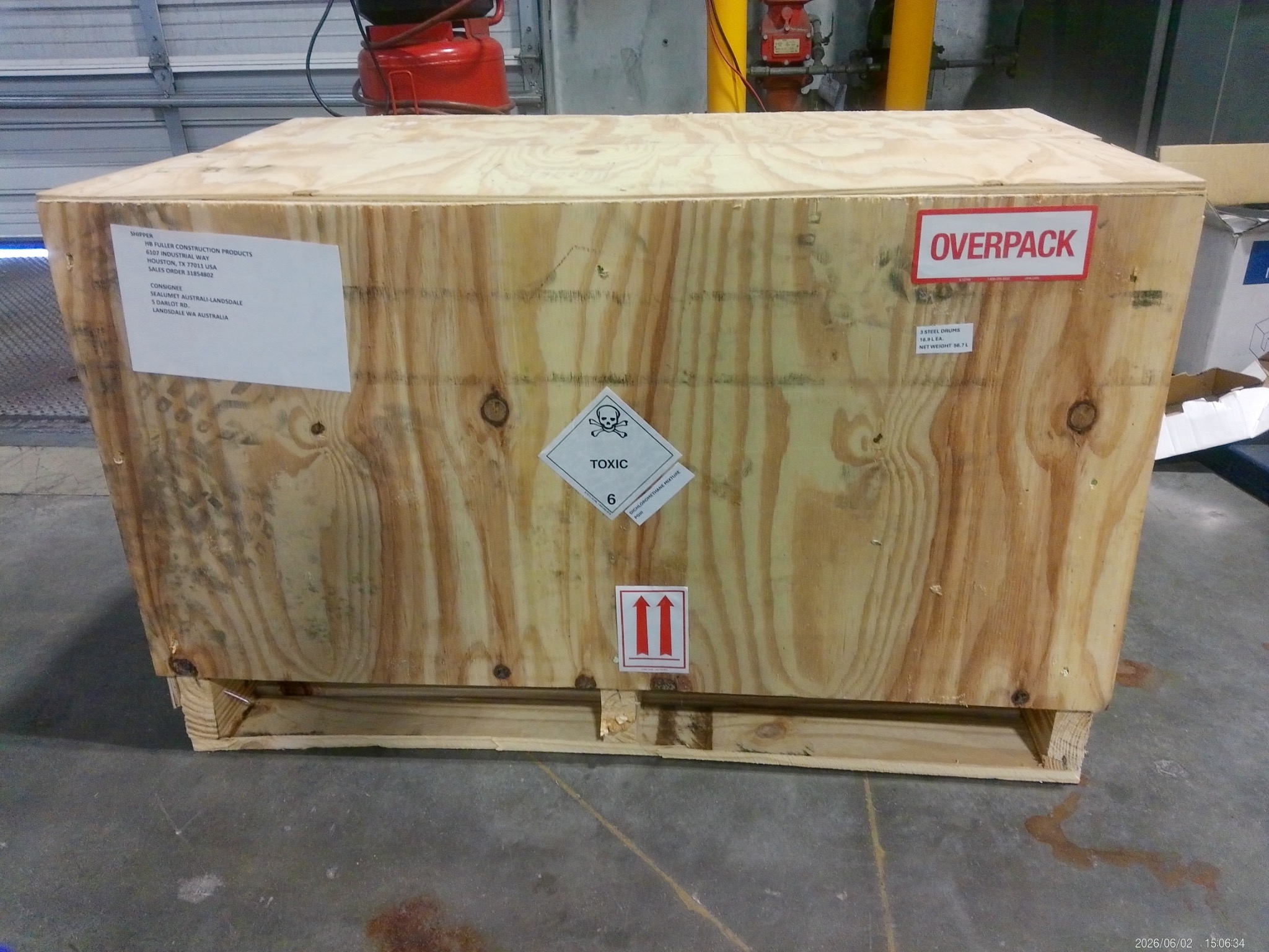 Wooden overpack with flammable liquid labels