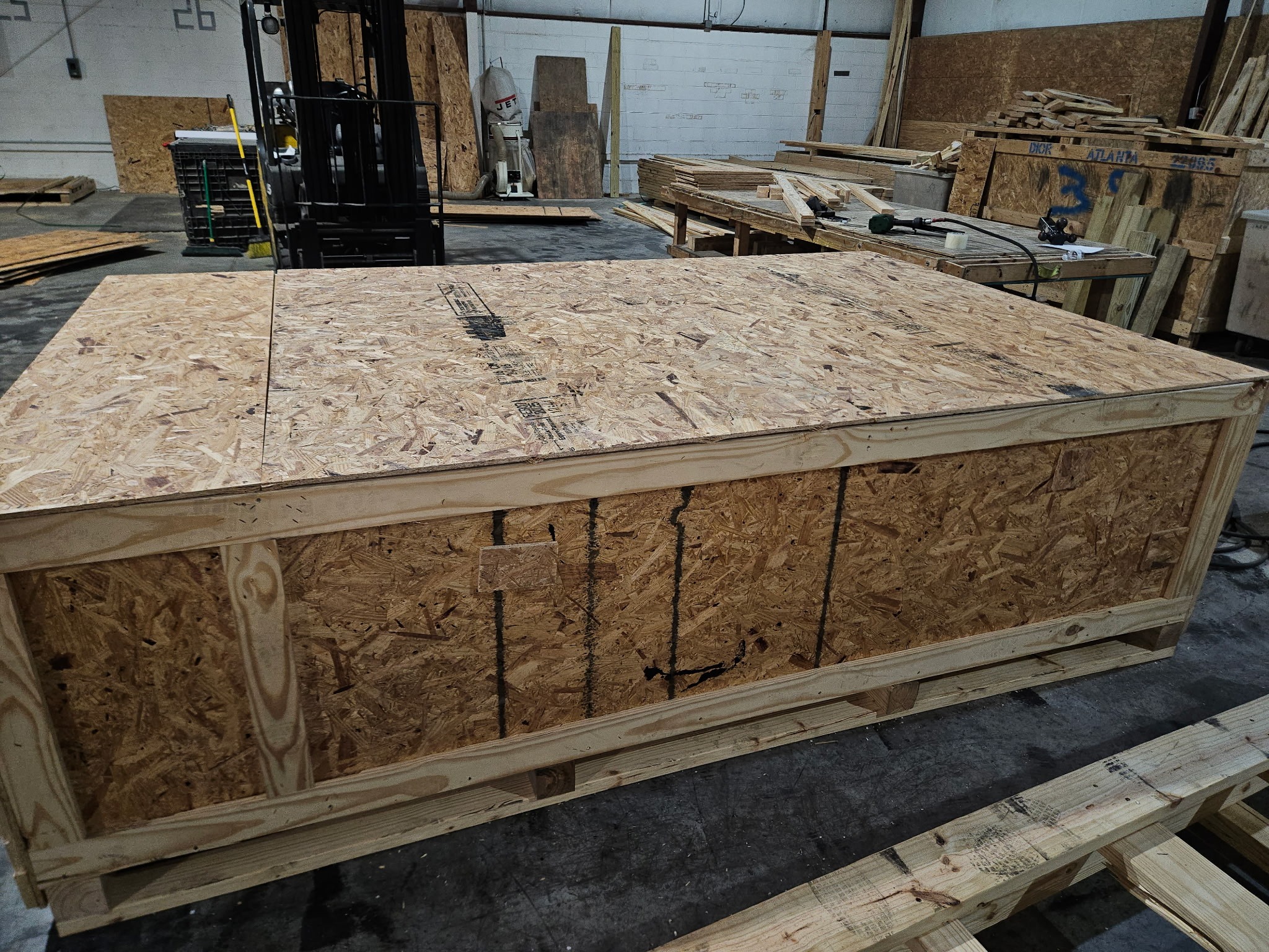 Large export crate built on a forklift-ready skid