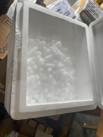 Insulated shipping box filled with foam cushioning