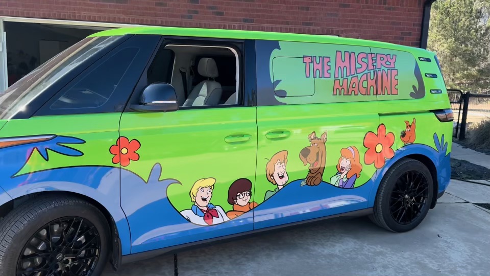 Green Mystery Machine custom van viewed from the driver side
