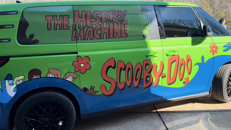 Green Mystery Machine custom van viewed from the passenger side