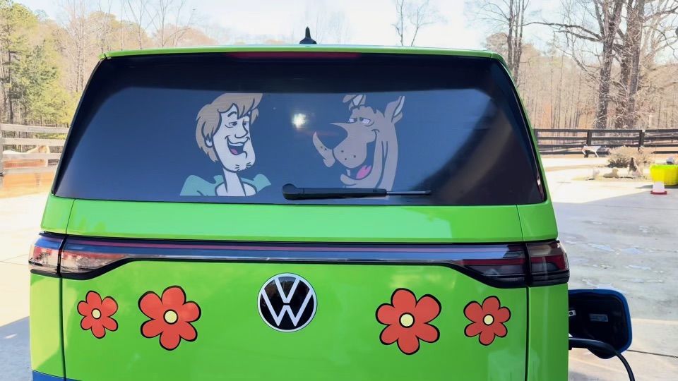 Rear view of the green Mystery Machine custom van with Scooby-Doo artwork